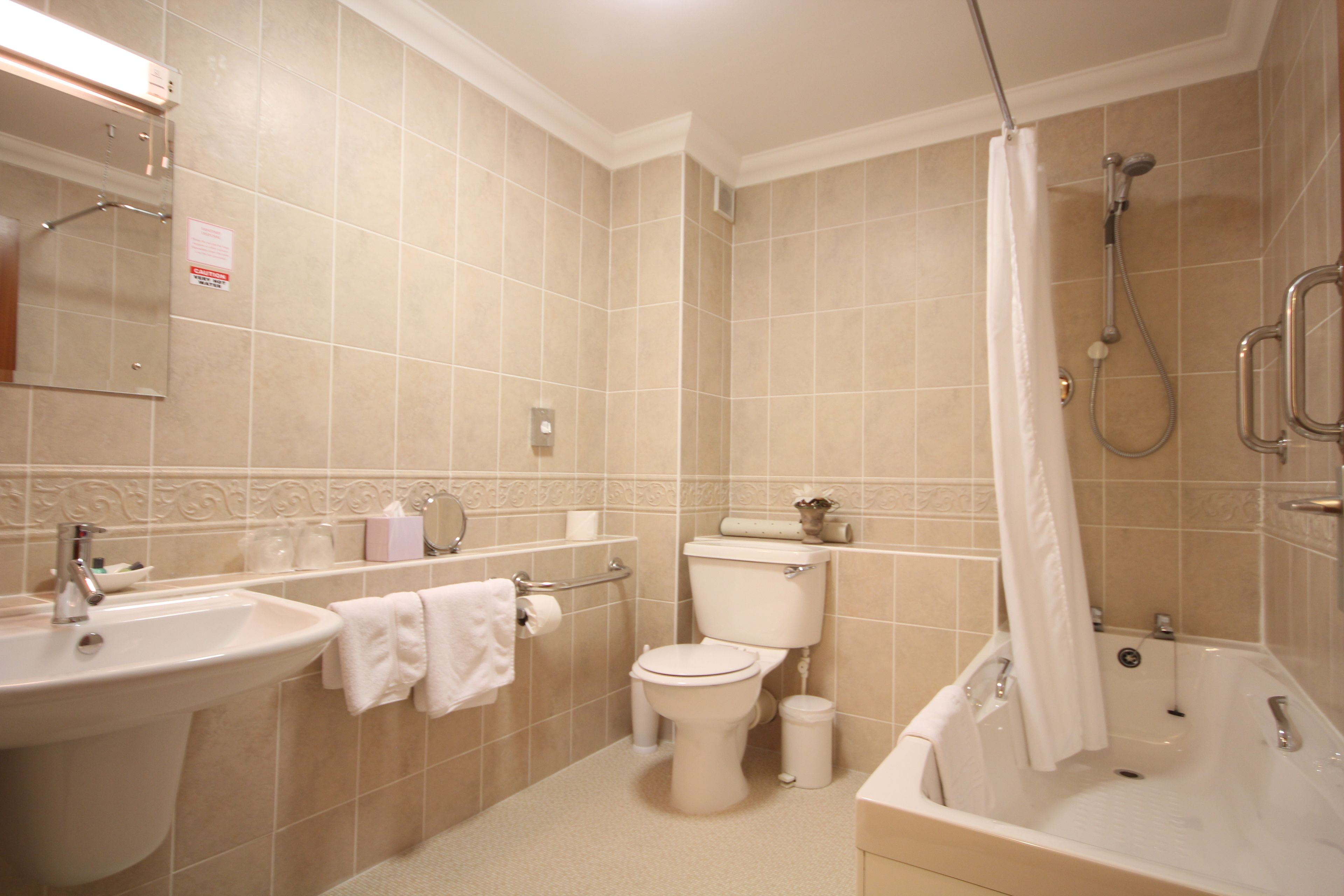combined shower/bathtub, free toiletries, hair dryer, towels