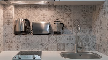Mini-fridge, stovetop, electric kettle, toaster