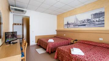 Standard Quadruple Room, 1 Bedroom | In-room safe, desk, free cribs/infant beds, free WiFi