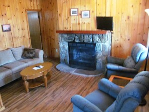 Cabin, 1 Bedroom (Juniper) | Living room | 32-inch flat-screen TV with cable channels, TV, fireplace