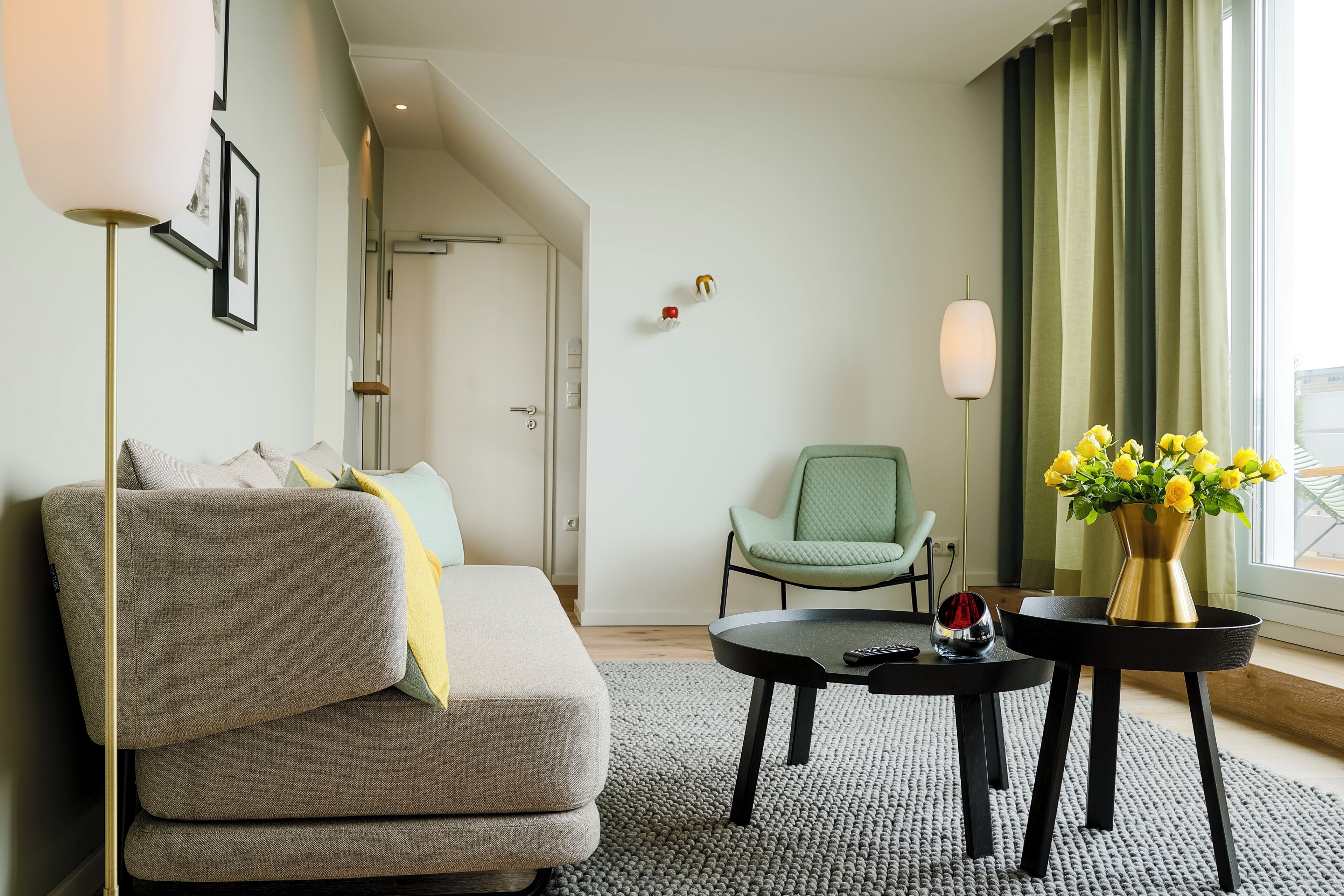 deluxe suite | living area | 65-inch flat-screen tv with satellite channels, tv, books