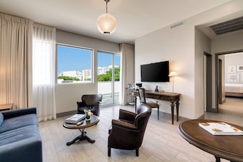 Suite, 1 Bedroom, Balcony | Living area | 48-inch flat-screen TV with satellite channels, TV, pay movies at The Plymouth South Beach