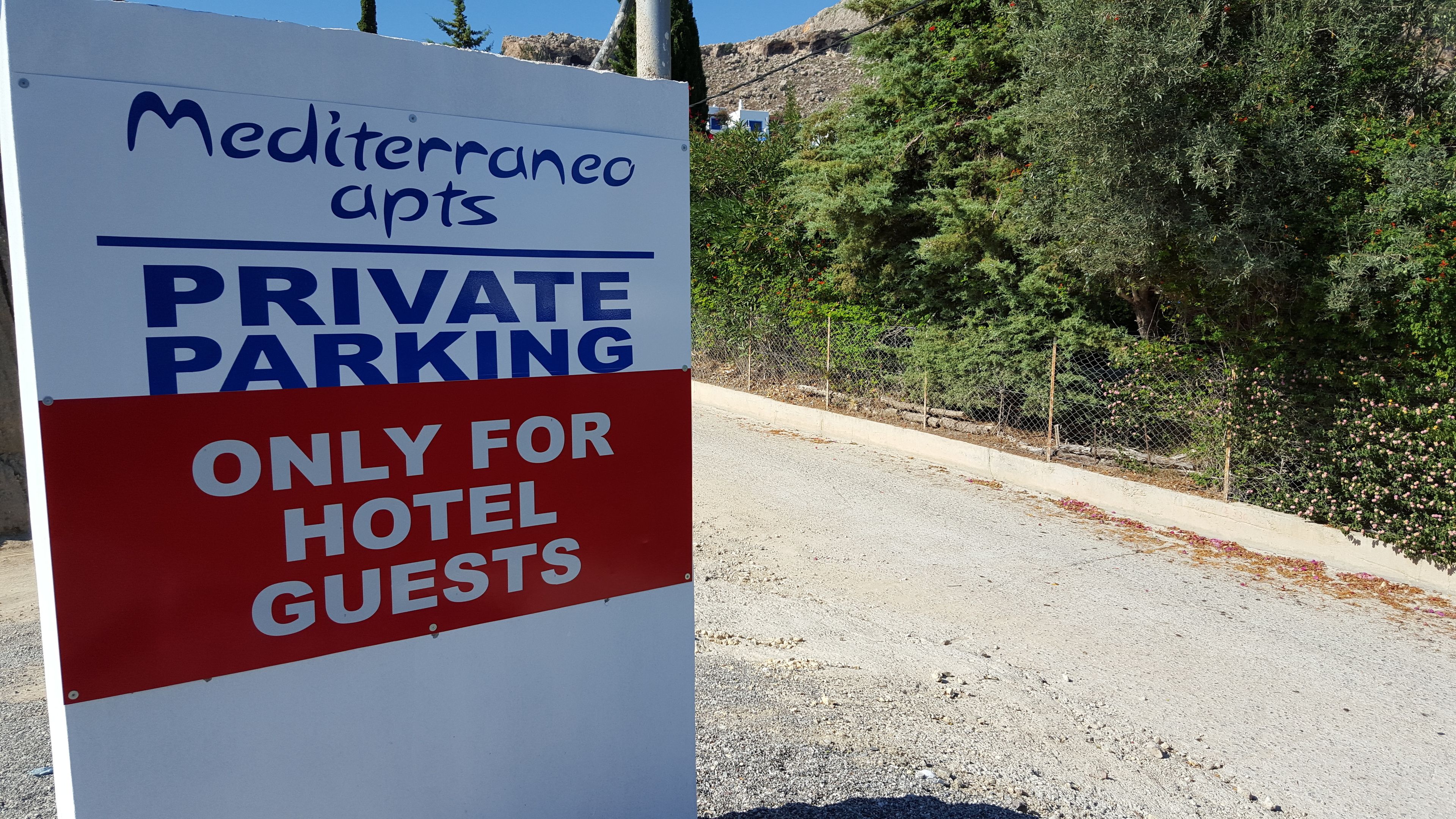 A sign indicating private parking is only for hotel guests.