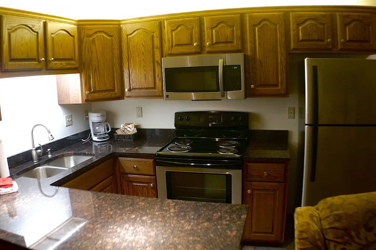 luxury suite, 1 queen bed with sofa bed, kitchen | private kitchen | fridge, microwave, coffee/tea maker