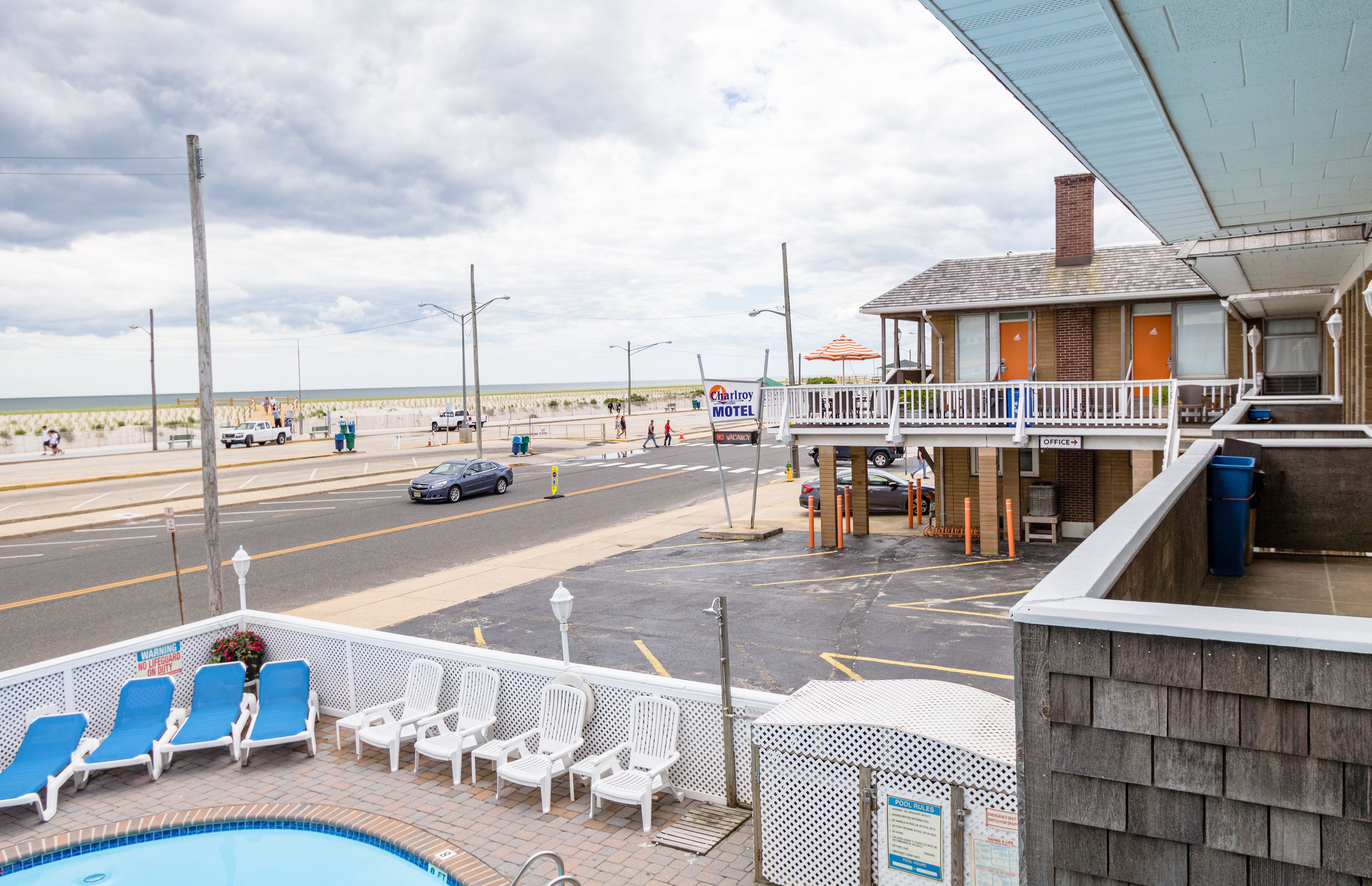 Seasonal outdoor pool, open 10:00 AM to 10:00 PM, pool umbrellas