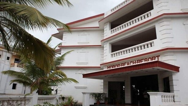A building with a sign reading "MORORRESORT" and a staircase leading to the entrance. - Mobor Beach Resort (GOA)
