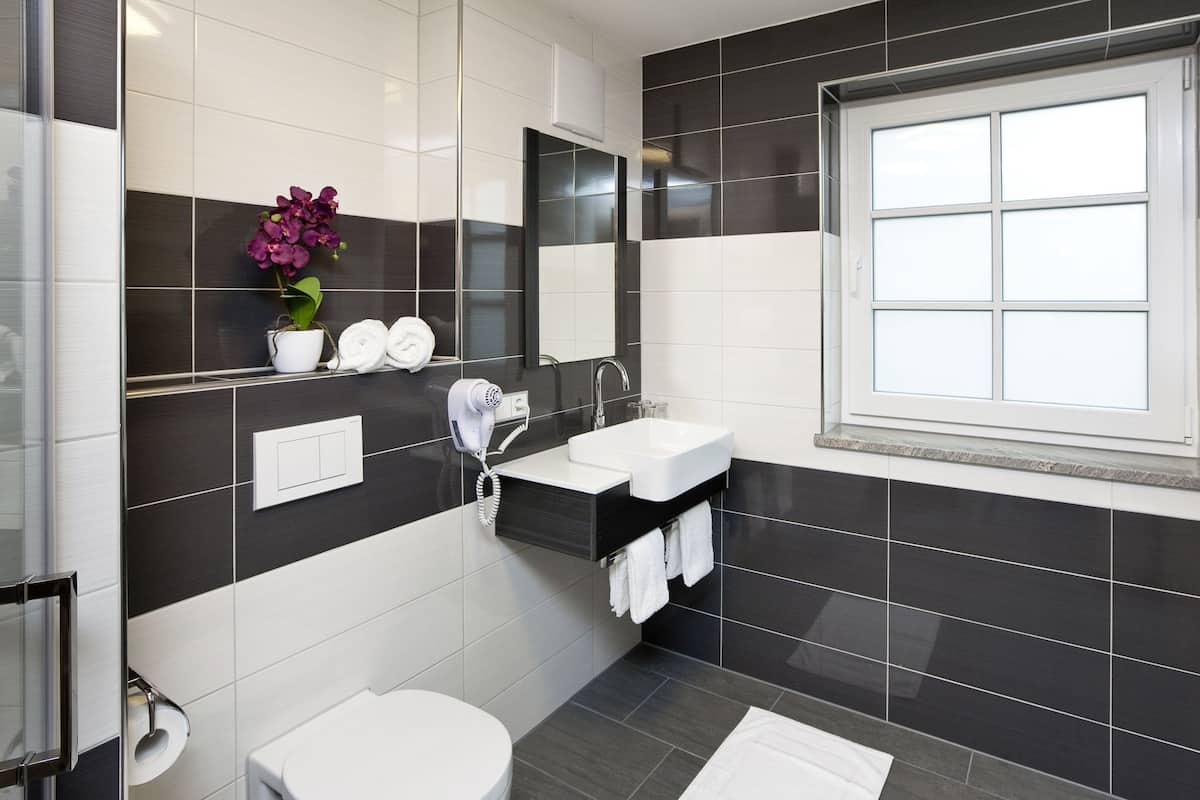 superior quadruple room | bathroom | hair dryer, towels, soap, shampoo