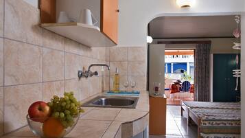 Fridge, stovetop, electric kettle, cookware/dishes/utensils