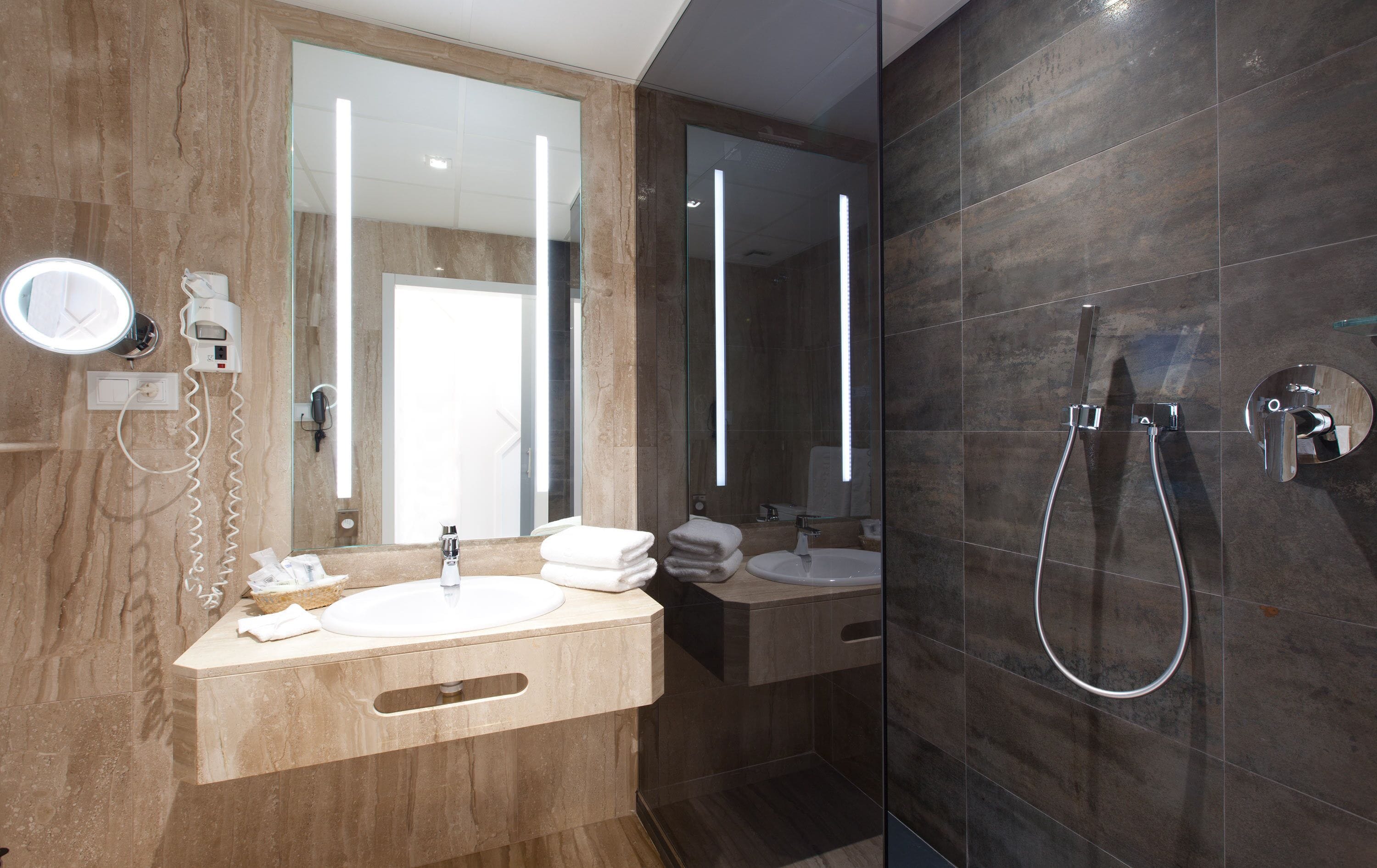 double room with puerta del sol views | bathroom | hair dryer, towels