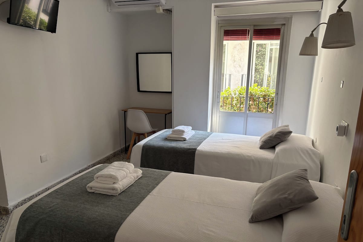 Desk, laptop workspace, free WiFi, bed sheets