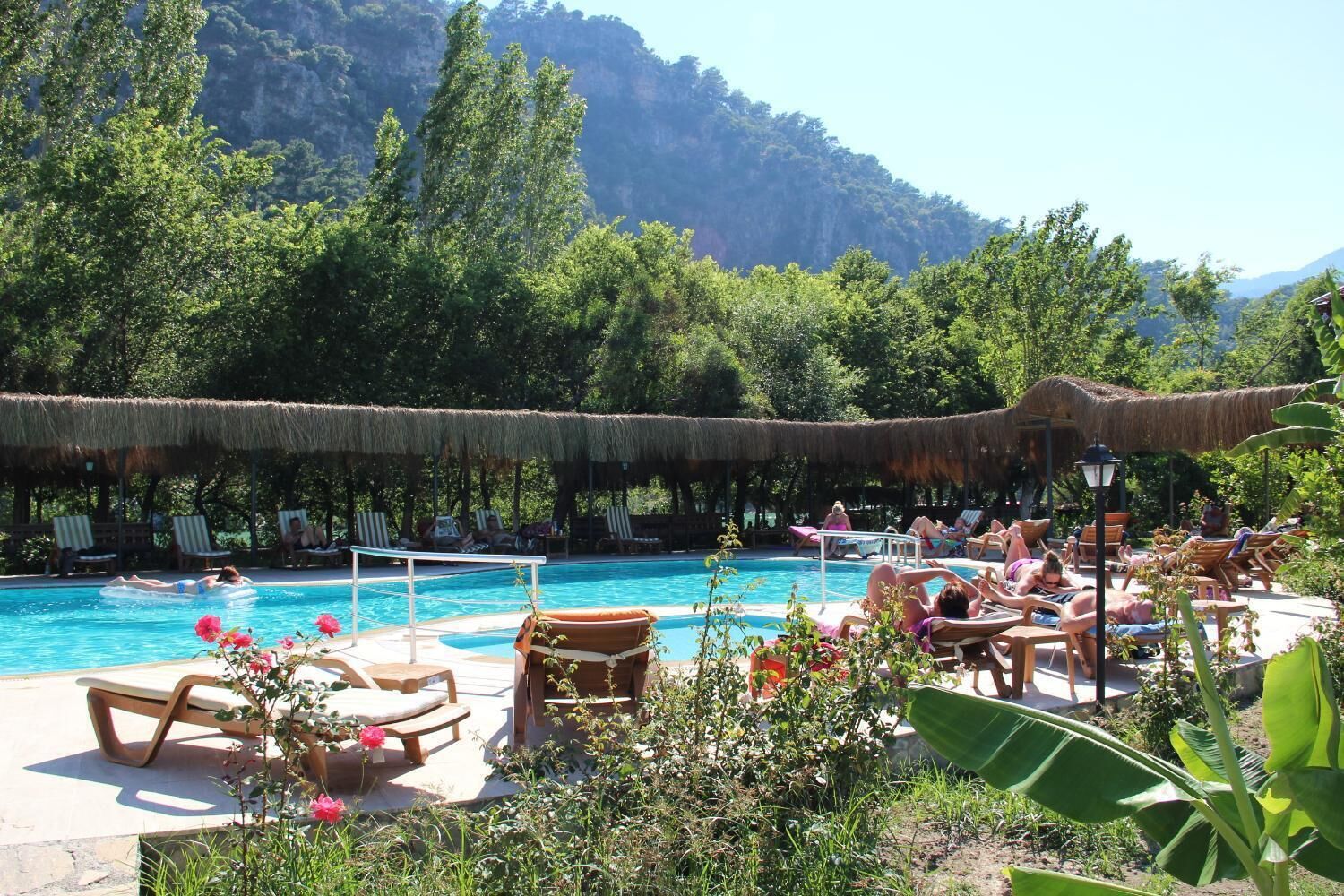 Seasonal outdoor pool, open 8:00 AM to 7:00 PM, pool loungers