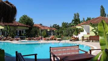 Seasonal outdoor pool, open 8:00 AM to 7:00 PM, pool loungers