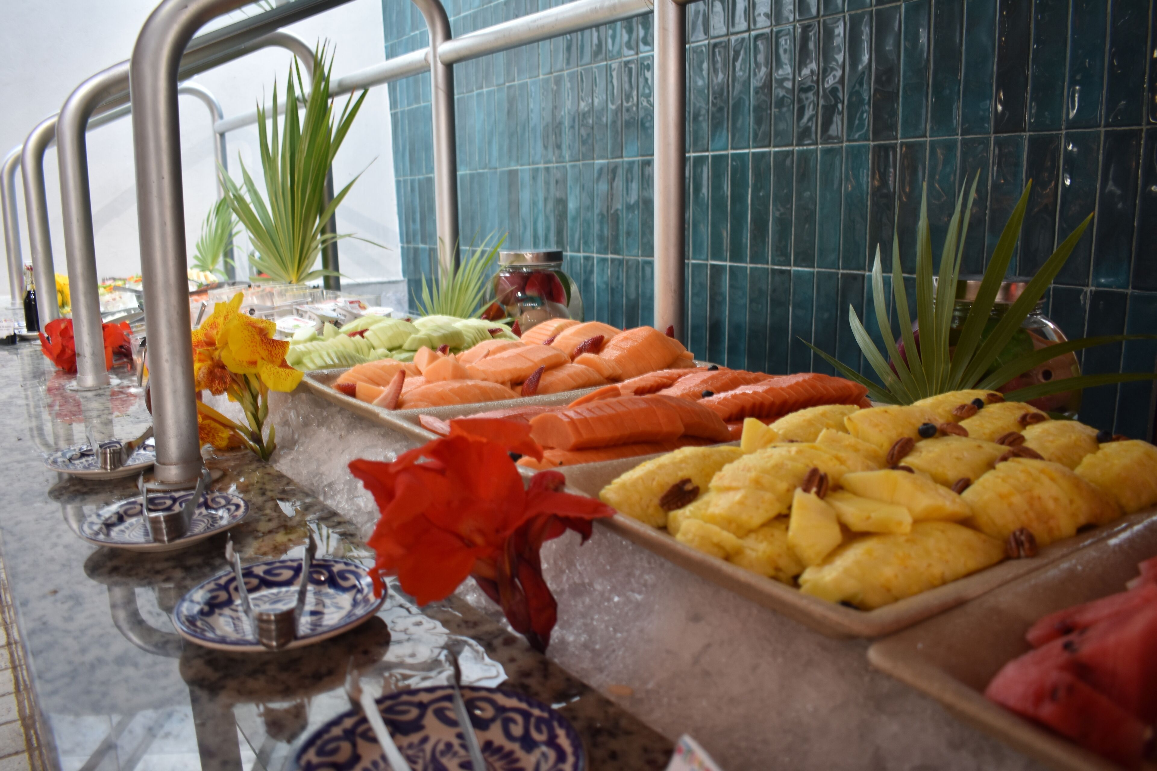 A buffet with various food items and decorative elements.