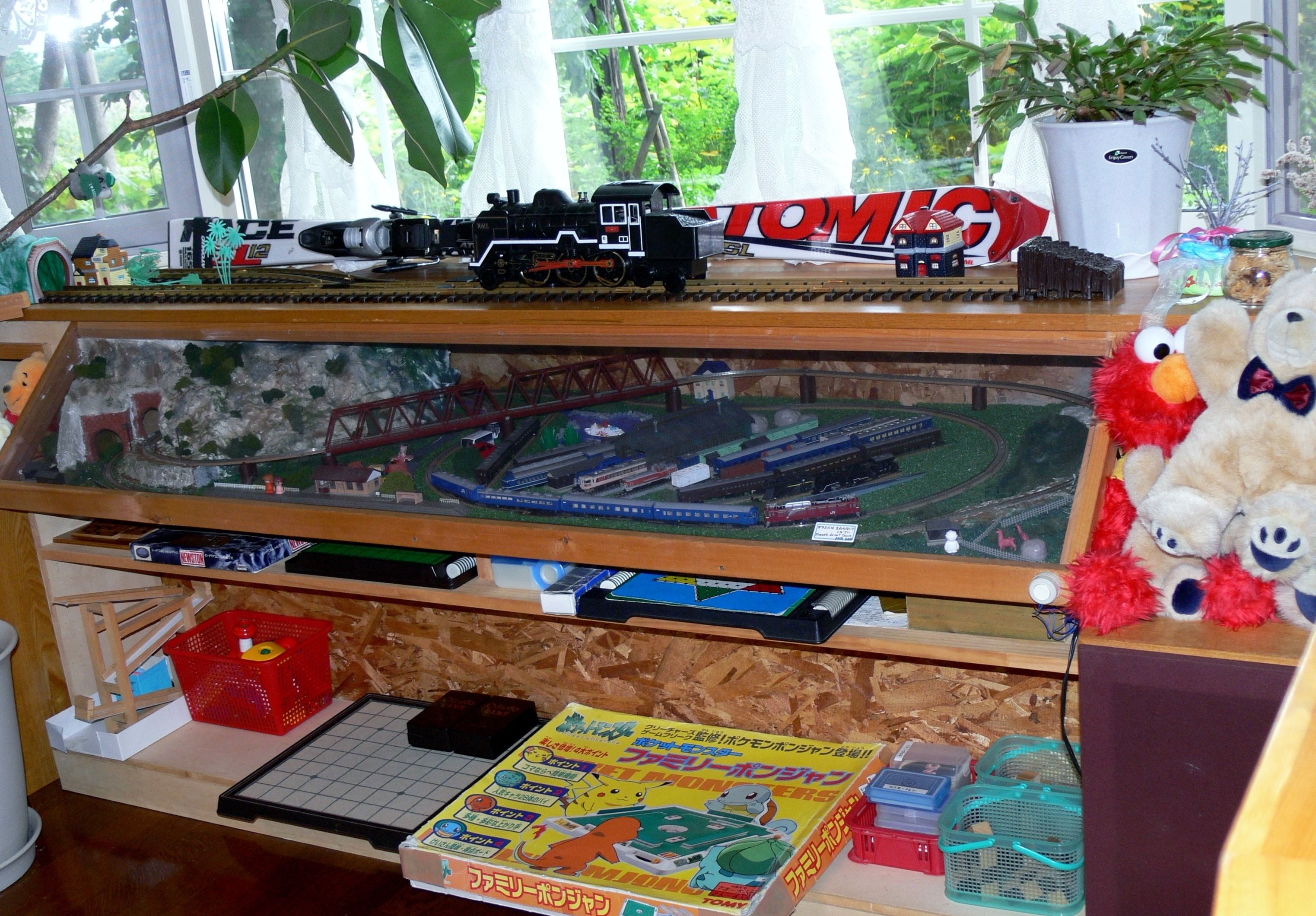 A model train setup with a detailed miniature train set and track layout.