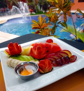 Fresh fruit and refreshing drinks await on your table.
