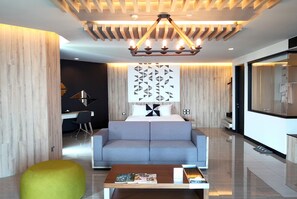 Sensation Suite Seafront | Living area | 30-inch flat-screen TV with cable channels, TV, DVD player - Tsix5 Phenomenal Hotel Pattaya (Pattaya)