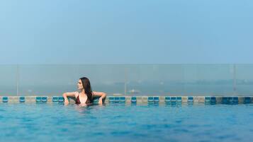 Outdoor pool, pool umbrellas, sun loungers