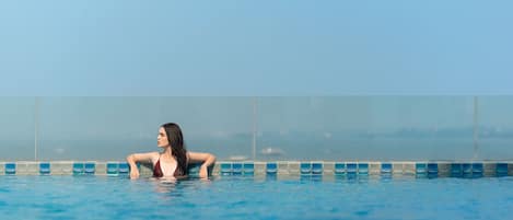 Outdoor pool, pool umbrellas, sun loungers