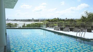 Outdoor pool, pool umbrellas, sun loungers