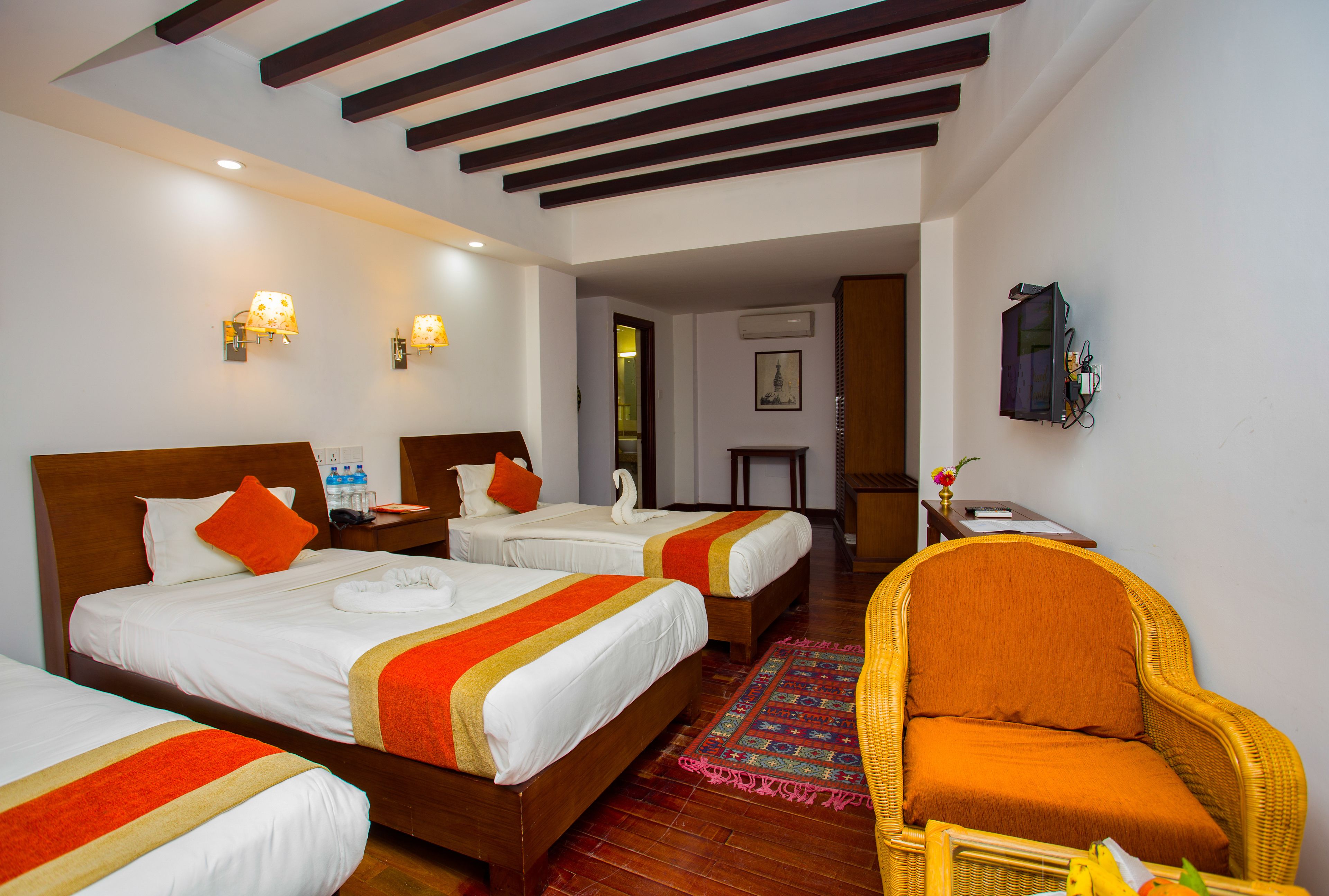 deluxe triple room, garden view | 1 bedroom, minibar, in-room safe, desk