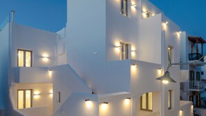 A modern white building with multiple balconies and staircases. - Argo Boutique Hotel (Naxos)