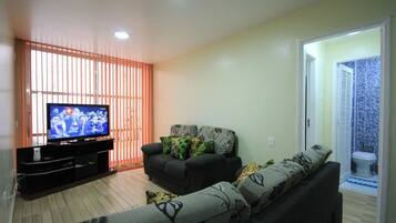 Standard Apartment, 2 Bedrooms, Lanai | Living room | Flat-screen TV