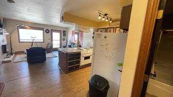 Suite, 2 Bedrooms | Living area | TV, fireplace