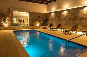 Indoor pool, outdoor pool, pool umbrellas, sun loungers