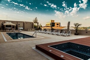 Indoor pool, outdoor pool, pool umbrellas, sun loungers