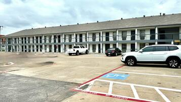 A motel with multiple rooms, a parking lot, and a fire lane.