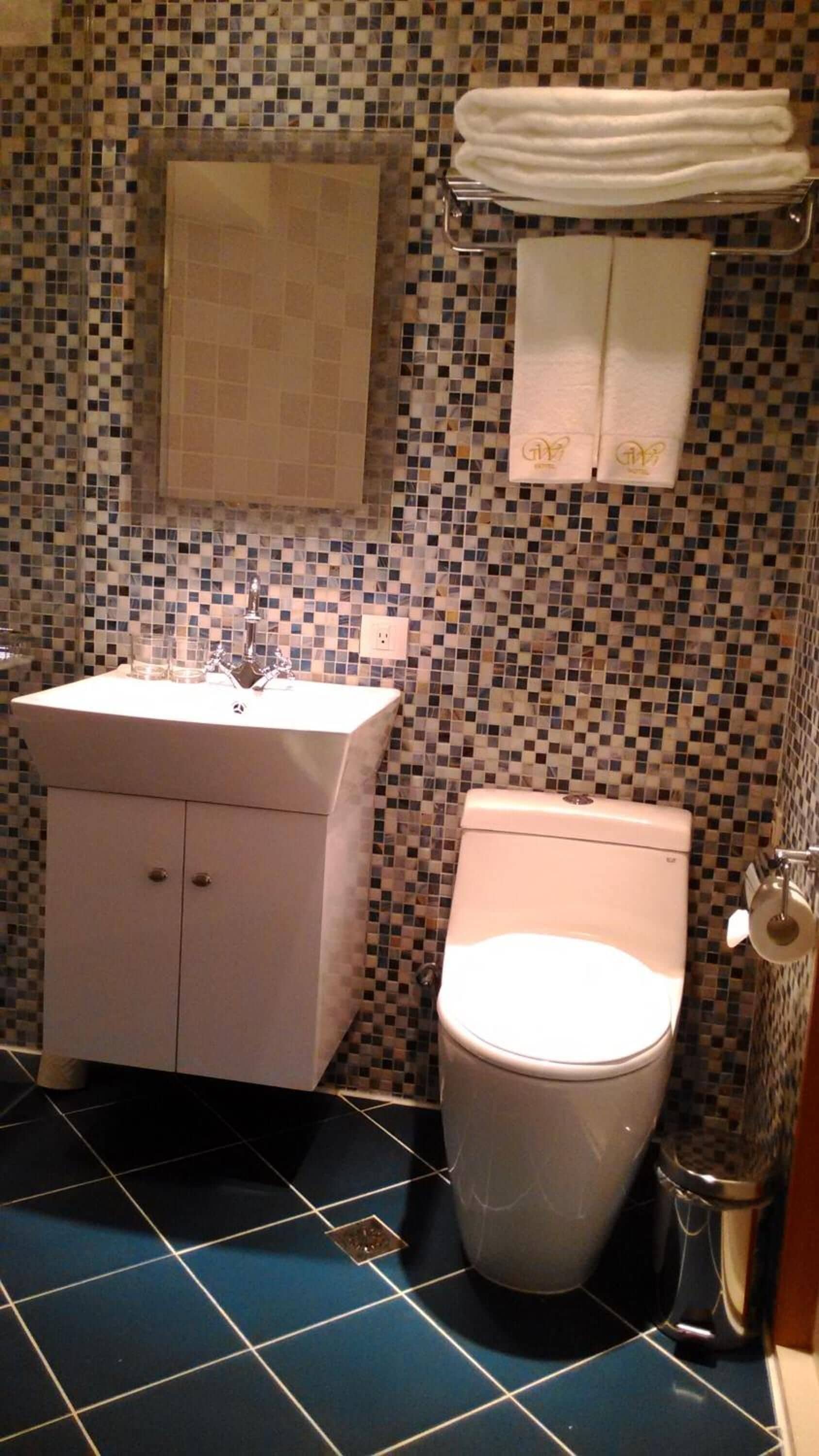 hair dryer, slippers, towels, shampoo