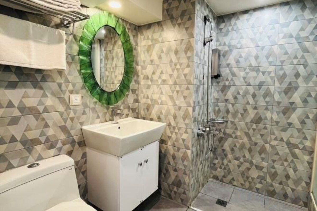 Bathroom | Hair dryer, slippers, towels, shampoo