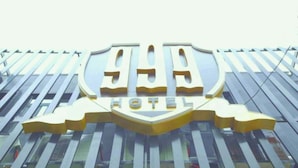A hotel sign with a shield emblem and the word "HOTEL" below it. - 999 Hotel (Angeles City)