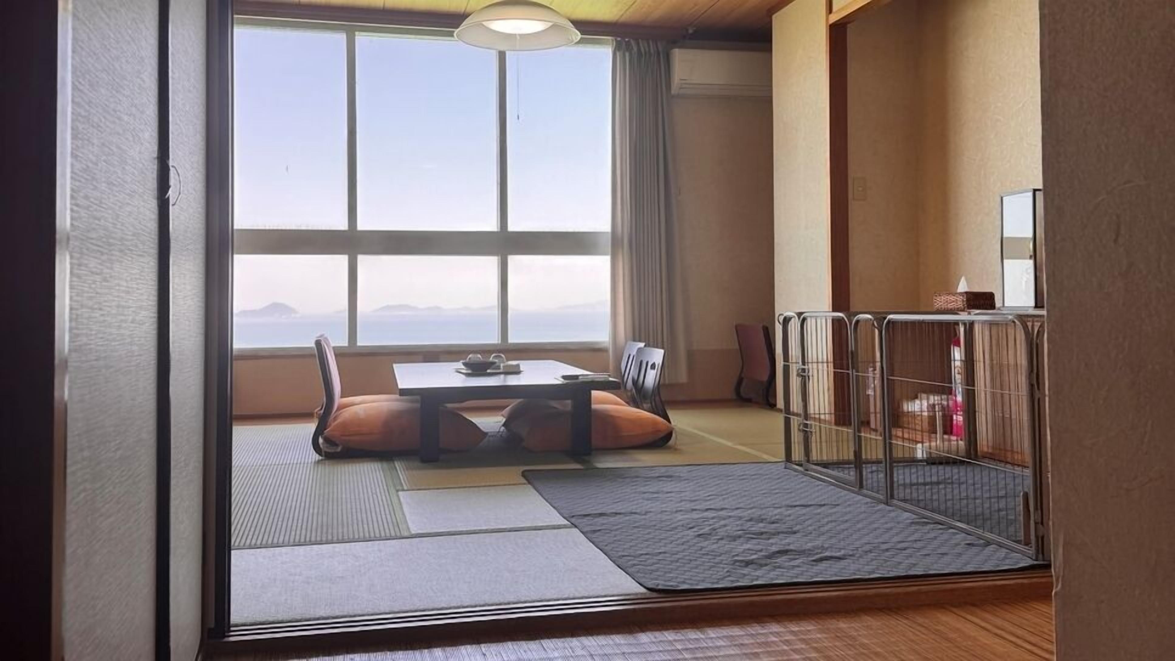 A traditional Japanese room with tatami flooring, a low table, and cushions.