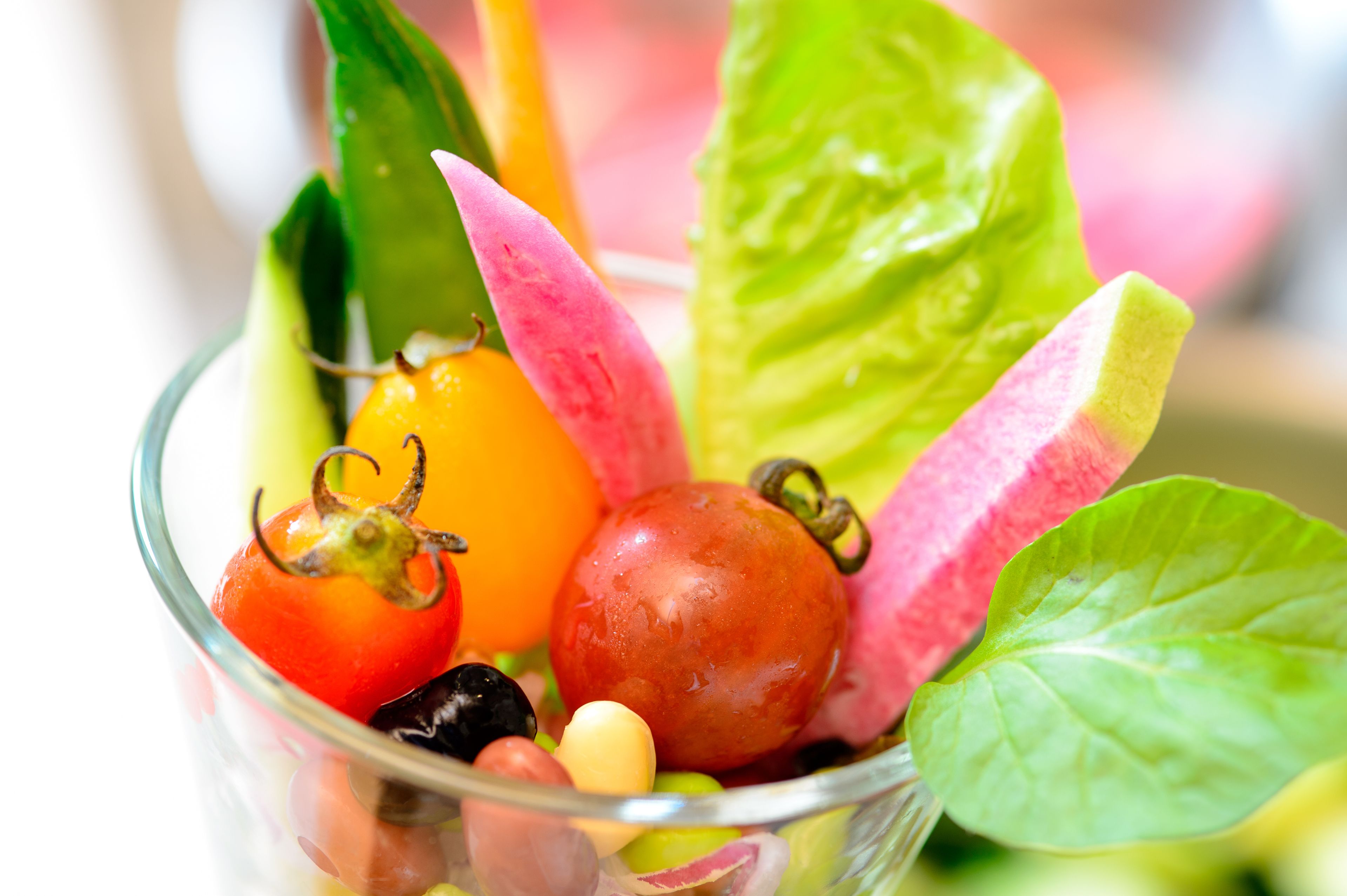 A bowl of assorted fruits and vegetables.