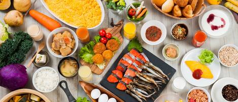 A variety of foods and beverages arranged on a table.