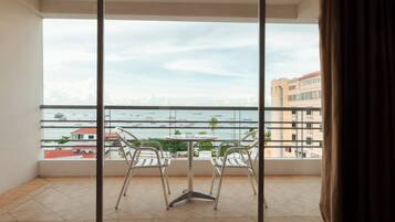 Suite, Sea View | Living area | 25-inch LCD TV with cable channels, TV