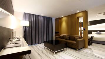 Suite | Living area | 50-inch LED TV with cable channels, TV, tablet