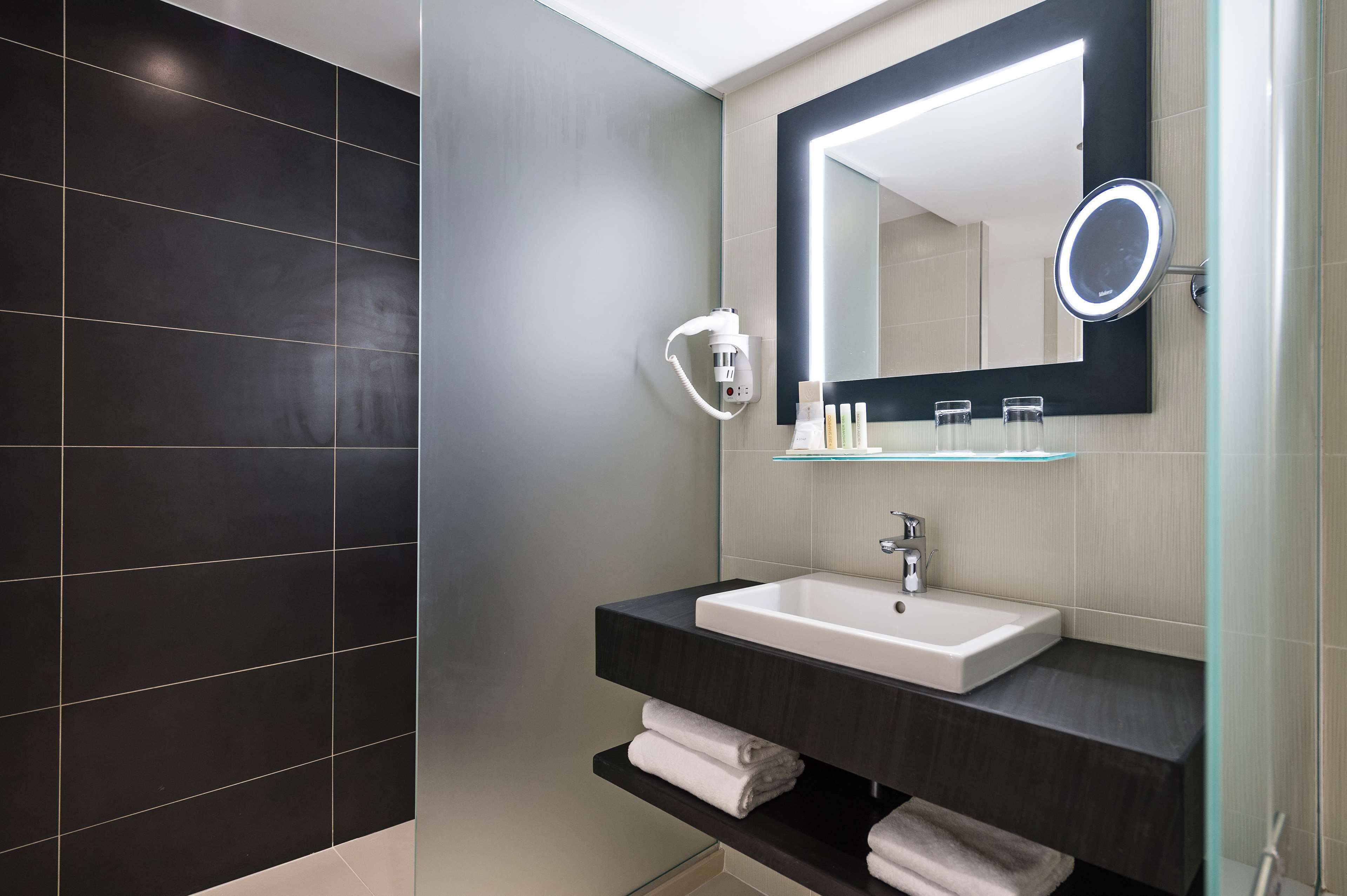 eco-friendly toiletries, hair dryer, slippers, towels