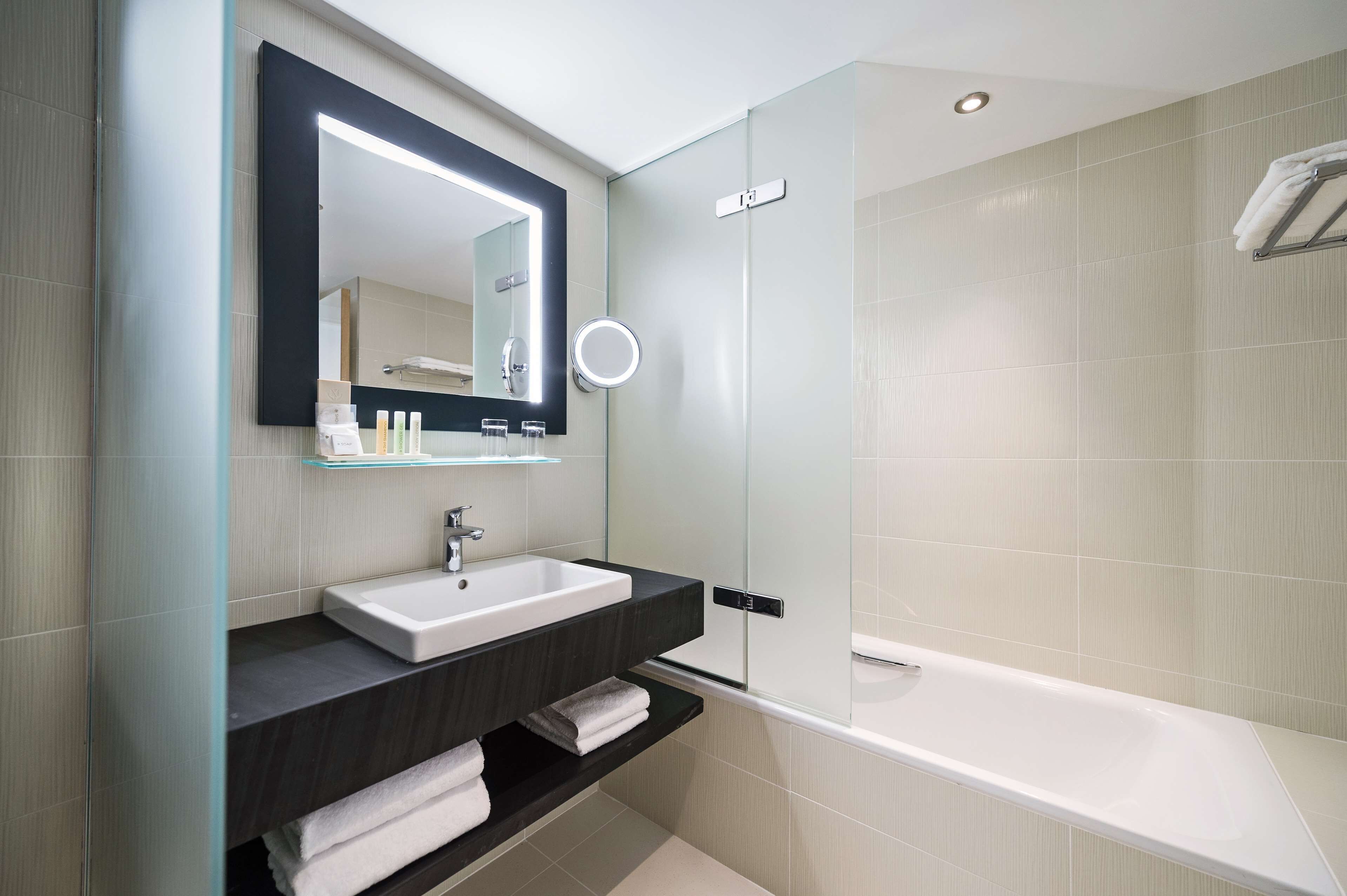 eco-friendly toiletries, hair dryer, slippers, towels