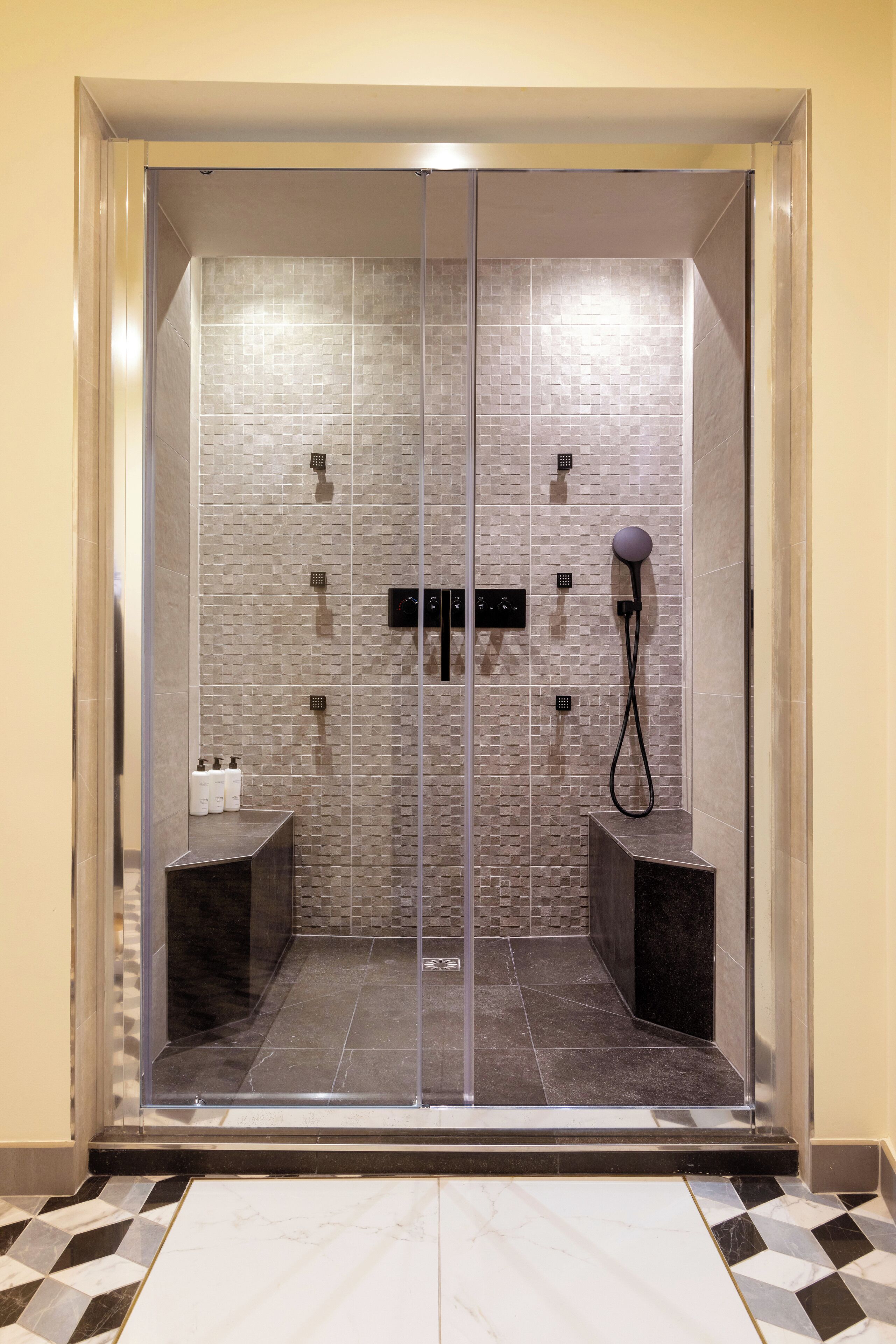 junior suite | bathroom | shower, hydromassage showerhead, hair dryer, bathrobes