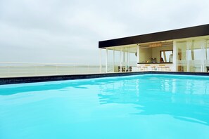 Outdoor pool, open 7 AM to 10:00 PM, pool loungers