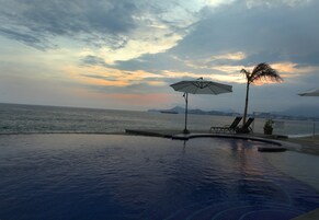 Outdoor pool, an infinity pool, sun loungers