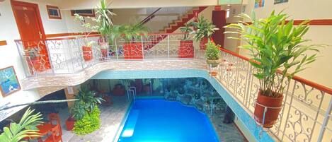 Outdoor pool, open 9:00 AM to 9:00 PM, pool umbrellas, sun loungers