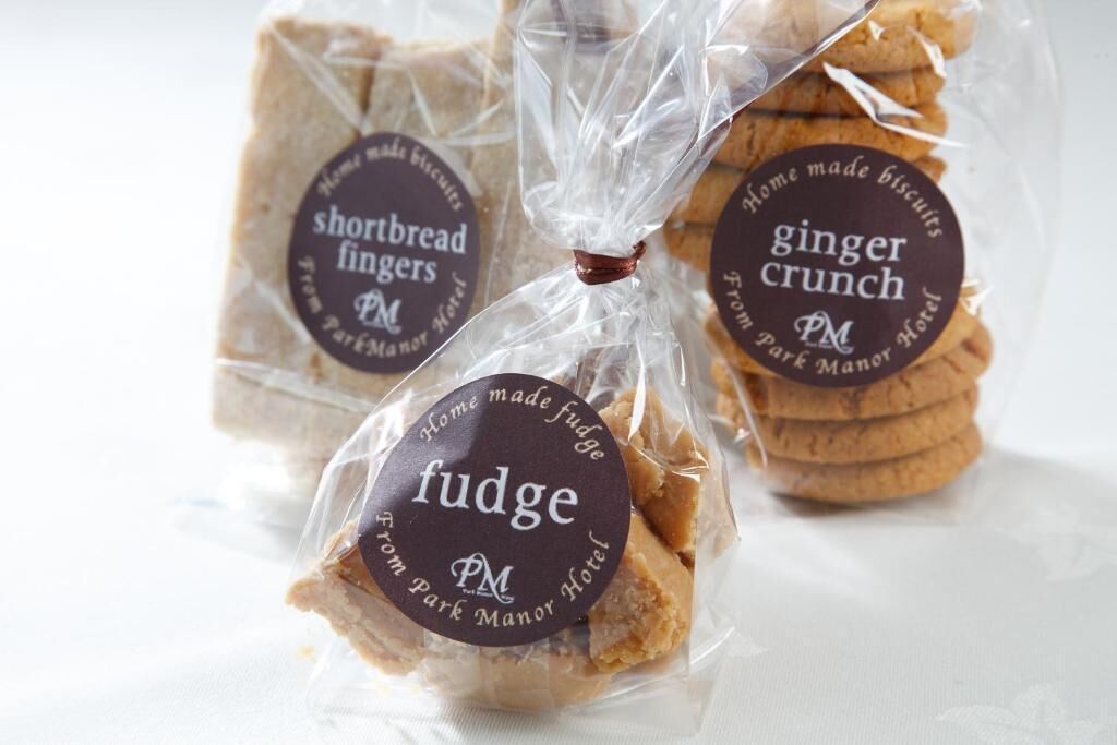 Three packages of shortbread fingers, ginger crunch, and fudge from Park Manor Hotel.