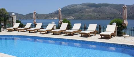 Outdoor pool, pool umbrellas, pool loungers