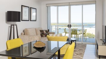 One Bedroom Riverview Apartment with balcony | Living room | 42-inch LED TV with satellite channels, TV, DVD player