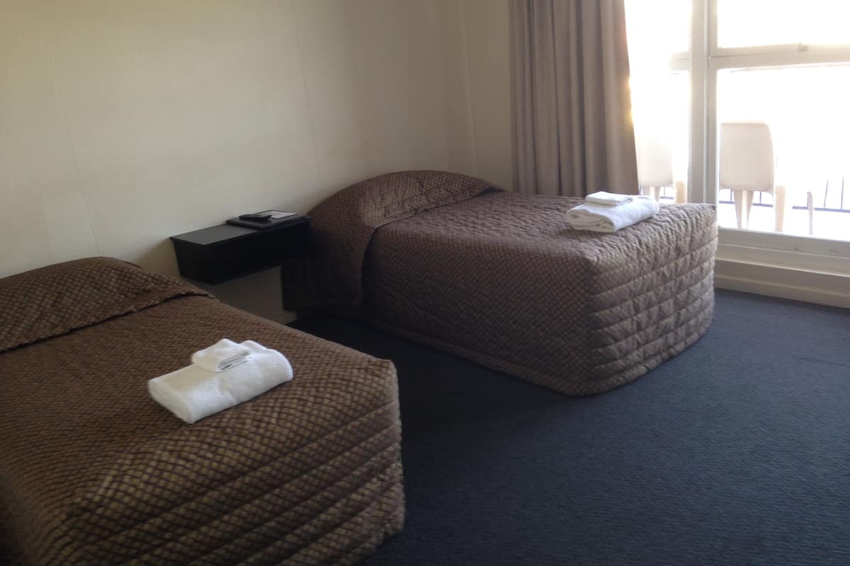 hotel twin share, shared bathroom | down duvets, iron/ironing board, free cots/infant beds, free wifi