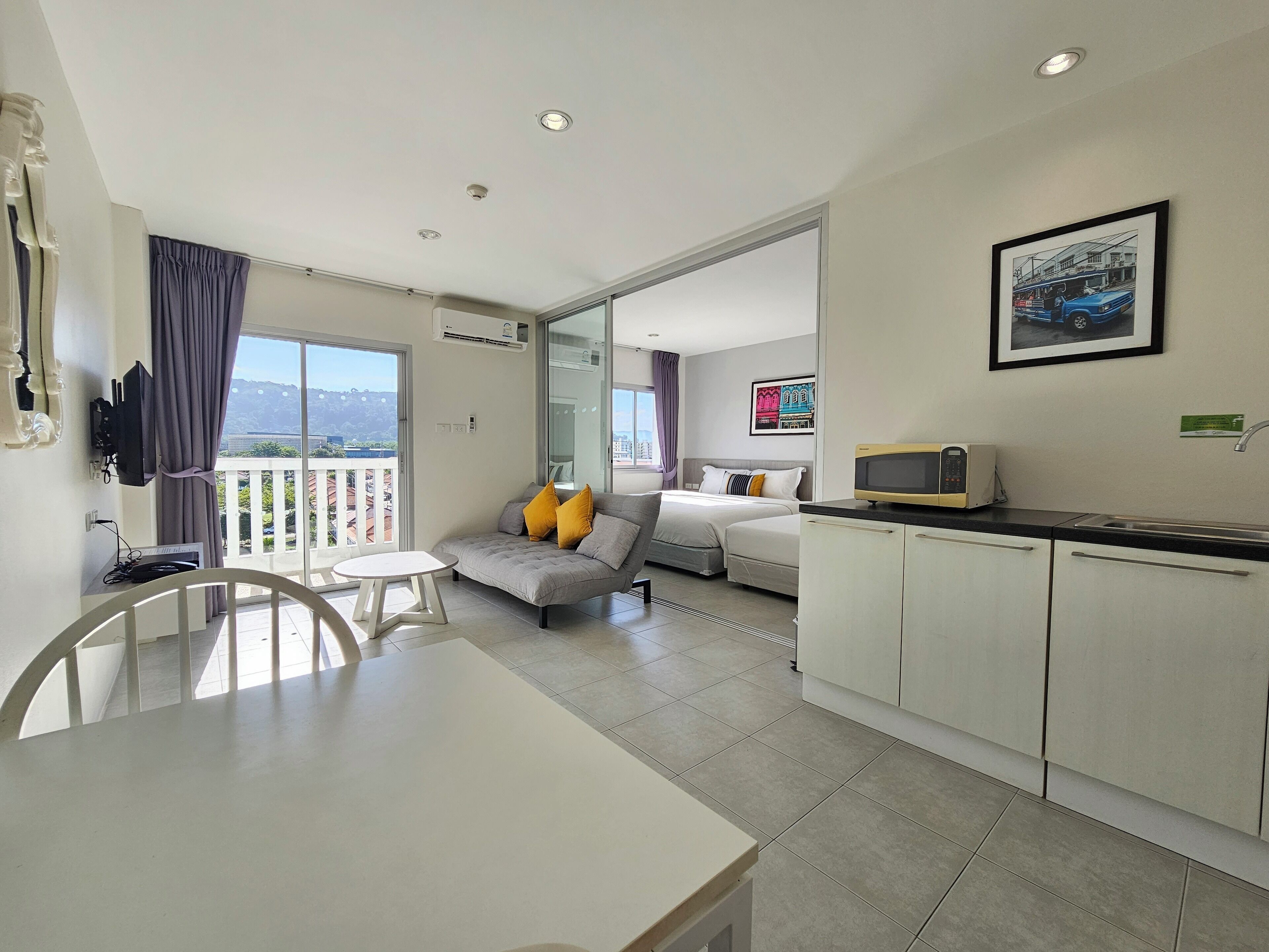 Executive Triple Room | Living area | 32-inch LCD TV with cable channels, TV