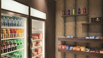 A hotel minibar with various beverages and snacks.